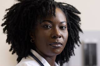A portrait of Dr. Dennar, who wears a stethoscope around her neck